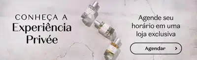 Apresenta uma promoção exclusiva de uma marca de cosméticos, com um frasco de fragrância do Boticário em destaque. O texto convida o leitor a agendar um horário para experimentar a "Experiência Privée" em uma loja exclusiva da marca.