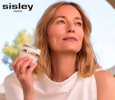 Banner publicitário de produtos cosméticos da marca Sisley Paris, com frascos de creme e sérum de rosas negras.