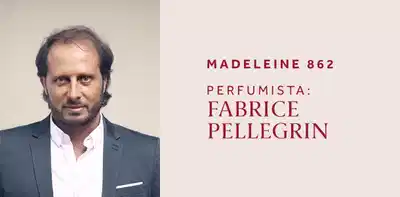 Um homem de cabelos escuros e olhar sério, vestido com terno. Madeleine 862, perfumista Fabrice Pellegrin.