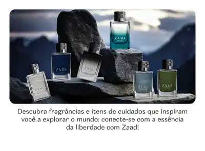 O banner apresenta uma coleção de fragrâncias e itens de cuidados da marca Zaad, em embalagens elegantes e sofisticadas, dispostos sobre rochas em uma paisagem montanhosa.