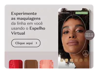 O banner mostra uma mulher negra em um template de smartphone, sobre fundo cinza, comunicando o Espelho Virtual, ferramenta para testar o tom ideal de maquiagem.