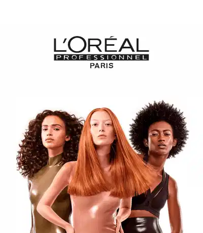 Três mulheres com diferentes texturas e cores de cabelo: uma com cabelo ondulado castanho, outra com cabelo liso comprido em tom laranja e uma terceira com cabelo crespo preto. Ao lado direito, logotipo da marca L'Oréal Professionnel Paris em preto e branco.