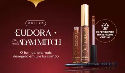 Frascos de batom líquido, gloss e lapiseira labial sobre fundo vinho, comunicando a nova collab Eudora Make e Adam Mitch.