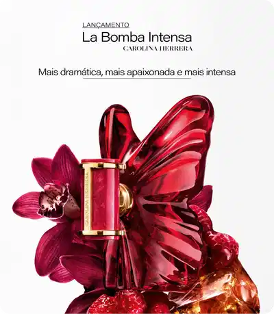 Lançamento La Bomba Intensa Carolina Herrera. Frasco de Eau de Parfum com acabamento dourado cercado por flores, pétalas e elementos frutados. Mensagem destacada: Mais dramática, mais apaixonada e mais intensa.