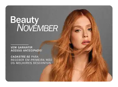 Mulher de cabelos ruivos longos sobre fundo cinza, convidando para fazer o cadastro com e-mail para receber em primeira mão os melhores descontos da Beauty November.