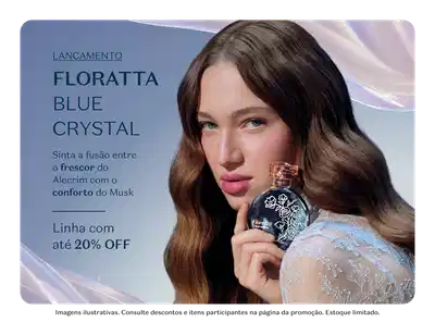 Imagem de um frasco de perfume Floratta Blue Crystal, com flores azuis e um ramo de lavanda ao redor. Texto "Lançamento Floratta Blue Crystal" e "Compre agora com 20% de desconto".