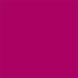 A imagem mostra um batom tipo bala, rosa, com a tampa ao lado. A embalagem é preta e prata com o logo da marca em preto.