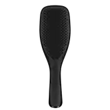 Escova de cabelo preta da marca Tangle Teezer, com design ergonômico e superfície ponteada para facilitar o desembaraço dos fios.