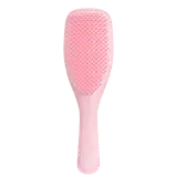 Escova de cabelo rosa da marca Tangle Teezer, com superfície texturizada e formato ergonômico para facilitar o penteado.
