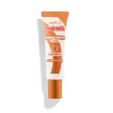 A imagem mostra um hidratante labial da marca Vult, com embalagem tubular, tipo bisnaga, dourada e branca. Rótulo com o nome do produto e demais informações em dourado e branco.