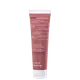 Tubo de creme esfoliante facial da marca Korres, com rótulo em inglês e grego, indicando ingredientes naturais e propriedades de suavização e iluminação da pele.