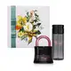 A imagem mostra um kit com uma caixa de presente com ilustração floral, vidro preto em formato de cadeado do sofisticado Eau de Parfum Her Code e frasco em tom acinzentado e tampa preta com rótulo dourado do óleo de massagem da linha Her Code Touch.
