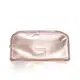 Nécessaire Siàge de cor rosa dourado, com acabamento brilhante e etiqueta com o nome da marca. O produto possui um design elegante e compacto, ideal para transporte.