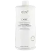 Frasco branco de condicionador Keune Care Derma Sensitive, com 1000 ml de capacidade. O rótulo apresenta o nome da marca, o tipo de produto e a indicação de que é aprovado dermatologicamente.