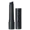 A imagem mostra uma embalagem de balm labial, cilíndrica, toda preta, com a tampa ao lado, também toda preta com a logo da marca MAC, escrito em preto. Tem um pouco do balm, também preto, à mostra.