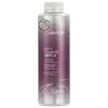 Shampoo detox Defy Damage da marca Joico. Embalagem cilíndrica roxa com detalhes prateados. Rótulo indicando que remove metais, minerais traço e cloro dos cabelos. Volume de 1L.