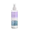 Frasco de spray da linha Blondorplex da Wella Professionals, com fórmula para proteção anti-frizz para cabelos loiros. Embalagem de plástico branco com detalhes em roxo e azul, contendo 145ml do produto.