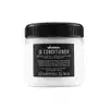 Frasco de condicionador Davines OI com 250 ml, embalagem branca e preta com rótulo destacando o nome do produto e a presença de óleo de roucou, indicado para todos os tipos de cabelo.