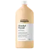 Frasco de item de perfumaria da marca L'Oreal Professionnel, com rótulo branco e amarelo claro. Contém 1,5 litros de "Absolut Repair" - um shampoo profissional para cabelos secos e danificados, com fórmula à base de proteínas e ômega-9.