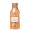 Frasco de condicionador Redken All Soft, com embalagem em tons de laranja e branco, contendo 300 ml do produto. O rótulo destaca o nome da marca, a linha "All Soft" e informações sobre a fórmula balanceada de pH e o complexo de 5% de umidade.