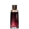 Frasco de perfume Malbec com design elegante em tons de vermelho e dourado, contendo líquido de cor rosada. O rótulo exibe o nome da marca em destaque.