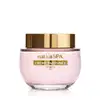 Frasco de vidro de creme perfumado da marca Nativa SPA Ameixa na cor rosada, com tampa dourada e embalagem rosa claro, contendo texto em dourado escrito Crème Parfumée no rótulo.