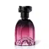 Frasco de perfume Floratta em formato arredondado, com tampa preta e gradiente de cor rosa a roxo. O rótulo exibe o nome da marca em destaque.