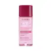 Frasco plástico transparente contendo líquido rosado. Tampa protetora na cor vinho. Embalagem com cores rosa e vinho, típicas da linha. Rótulo transparente com texto em rosa pink, quase vermelhor, e alaranjado. Nome da marca Niina Secrets em branco.