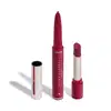 O produto apresentado na imagem é um batom da marca Niina Secrets Eudora, de cor rosa vibrante. São dois produtos em um: uma lapiseira delineadora com a ponta afiada e o batom em formato stick, com embalagem também rosa e detalhes dourados.