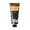 Embalagem de creme perfumado para mãos da marca Eudora Instance, com rótulo amarelo e preto destacando a fragrância "Baunilha Intensa". O produto contém glicerina vegetal e é livre de parabenos.