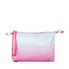 Necessaire de maquiagem em formato retangular. Exterior em material sintético com degradê de cores pastel, indo de azul claro a rosa com pequenos detalhes brilhantes espalhados. Design delicado e feminino, ideal para guardar e transportar cosméticos.