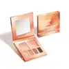 Paleta de sombras e iluminador da marca Quem Disse, Berenice, em embalagem de metal com acabamento rosé, contendo sombras em tons quentes e iluminador.