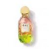 Frasco de perfume O.U.i. com design escultural em tons de rosa, amarelo e verde. Rótulo com nome da marca e informações sobre a fragrância "Madeleine 922 La Pistacherie".
