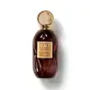 Frasco de item de perfumaria da marca O.U.i, com tampa dourada e corpo de vidro âmbar, rótulo com texto "Désir Parisien 750 pour femme" em fundo amarelo.