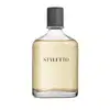 Frasco de fragrância Styletto com tampa preta texturizada e rótulo em letras pretas sobre fundo amarelo claro. O frasco é de vidro transparente, permitindo visualizar o conteúdo líquido.