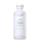 Frasco branco da linha Care da Keune, contendo Shampoo Absolute Volume. O produto é destinado a volumizar cabelos normais a finos, conforme indicado no rótulo.