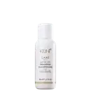 Frasco branco de 80 ml da linha Care da Keune, contendo o Shampoo de Óleo Satinado, com rótulo destacando a luminosidade para cabelos opacos.
