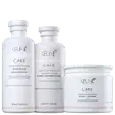 Três produtos de cuidados capilares da marca Keune Care, incluindo um shampoo, um condicionador e uma máscara, todos em embalagens brancas com detalhes em preto e cinza.