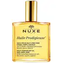 Frasco dourado de óleo multiuso da marca Nuxe, com rótulo em preto e amarelo indicando o nome "Huile Prodigieuse" e a descrição do produto como um óleo seco multifuncional para rosto, corpo e cabelos.