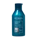 Frasco de shampoo Redken Extreme, com fórmula pH balanceada, contendo 3% de complexo de proteína, para cabelos danificados. Embalagem de 300 ml na cor azul escuro.