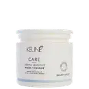 Frasco branco da linha Keune Care, contendo máscara para couro cabeludo sensível, com rótulo em preto e branco indicando o nome do produto e sua função de acalmar o couro cabeludo sensível.