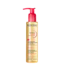 Frasco de óleo de limpeza micelar da marca Bioderma, com bomba doseadora vermelha, rótulo dourado e texto "Sensibio Micellar Cleansing Oil" em destaque.