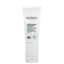 Tubo branco com rótulo preto e azul claro. Texto "Redken 5th Avenue NYC" e "Acidic Bonding Concentrate 5-min Liquid Mask". Informações sobre ingredientes e concentração de ácido cítrico.