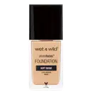 A imagem mostra uma embalagem de base líquida da marca Wet n Wild. É o produto PhotoFocus Foundation. A embalagem é um frasco retangular com o rótulo frontal que exibe o nome do produto e a marca.