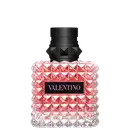 Frasco de perfume Valentino em formato geométrico, com tampa preta e corpo de vidro rosa brilhante, exibindo o nome da marca em destaque.