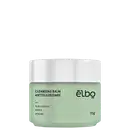 Frasco de limpeza facial Elbo, com 70g de produto, em embalagem branca e verde-clara, contendo rótulo com o nome "Cleansing Balm Antioleosidade" e ingredientes como ácido salicílico, matcha e gengibre.