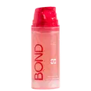 Frasco plástico rosa com tampa vermelha contendo sabonete líquido da marca Bond Rio com ingredientes de açaí e niacinamida, com texto "reset" visível no rótulo.
