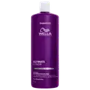 Frasco de shampoo da linha Ultimate Color da Wella Professionals, com 1 litro, em embalagem roxa com detalhes em branco, contendo informações sobre a fórmula com glicina e pró-vitamina B5.