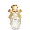 Eau de Parfum "Le Temps des Rêves" Annick Goutal em frasco de cristal transparente com tampa dourada esférica, laço de fita bege e rótulo circular branco com detalhes florais dourados.
