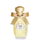 Eau de Parfum Un Matin d'Orage da Annick Goutal em frasco de vidro amarelo claro com tampa dourada esférica, decorado com laço de fita bege e rótulo circular branco com detalhes florais dourados.